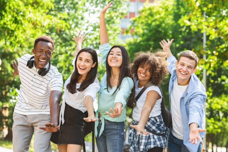 Five students smiling.