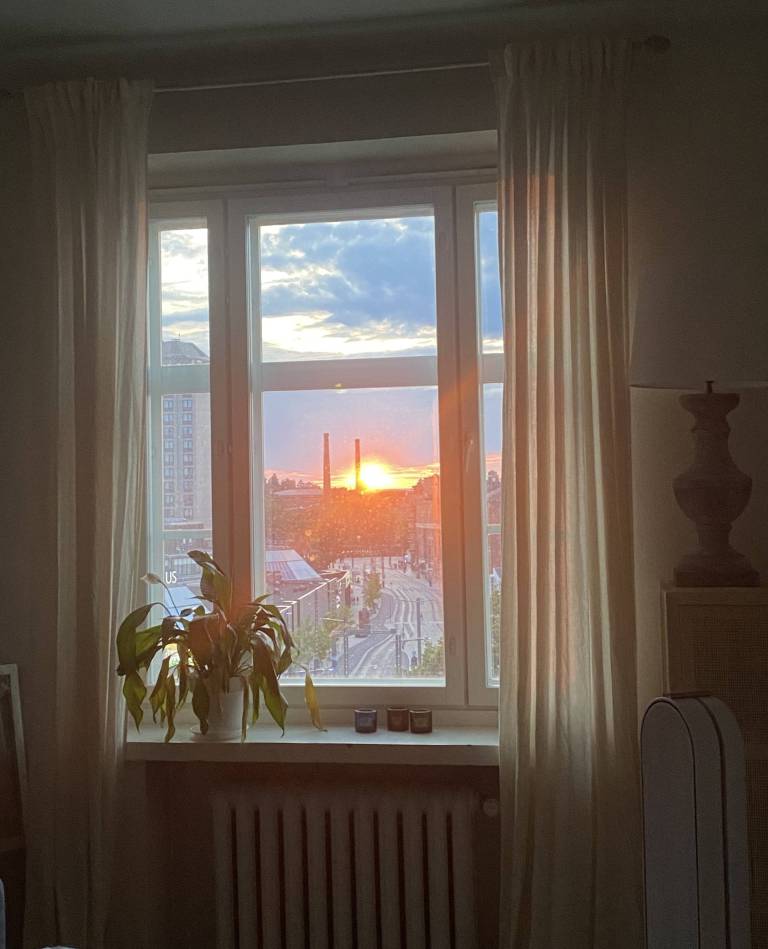 View from a window onto a setting sun