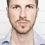 young man's face, serious expression