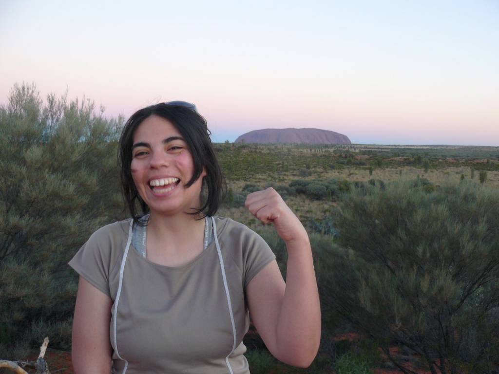 Georgina smiling and standing in the field