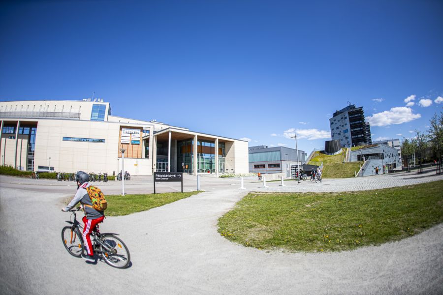 A student biking on the campus.