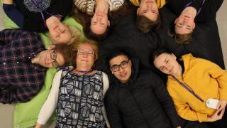 project participants lying in a circle