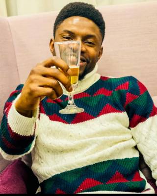 A student raising a glass