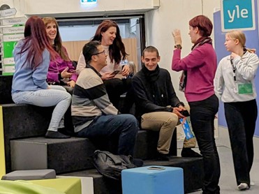 Group of people in the middle of classroom.
