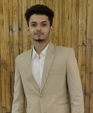 A male student with short dark hair