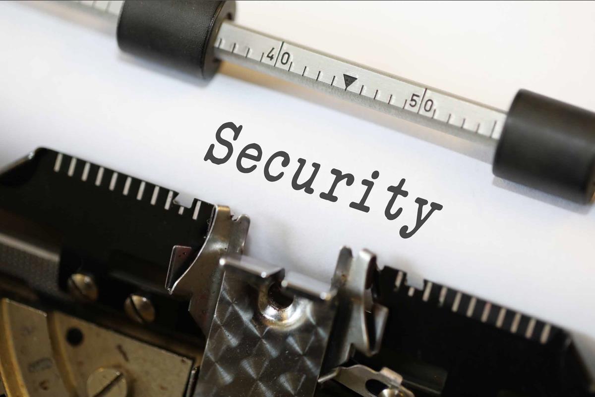 Typewriter writing word 'Security' into paper.