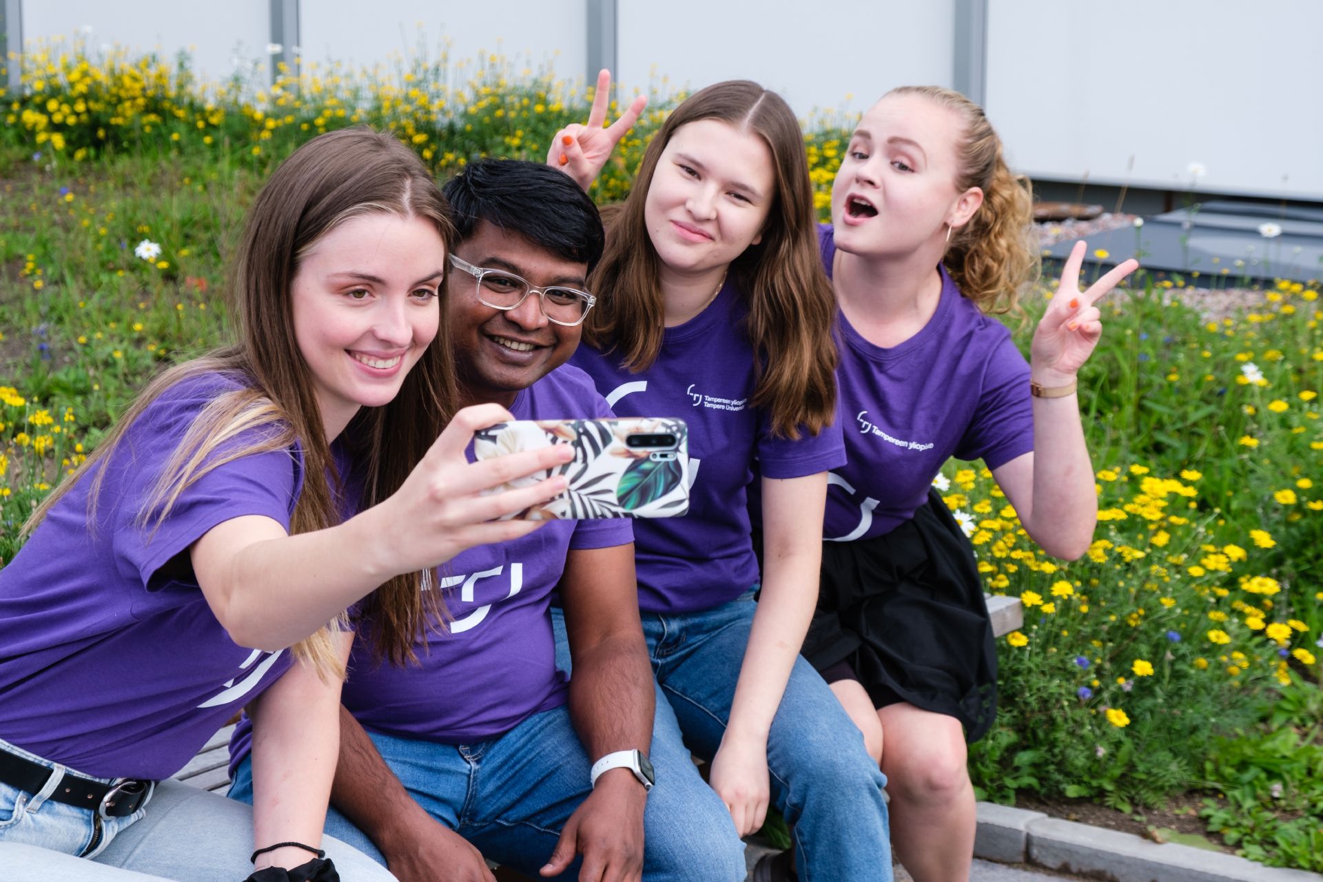 Four student ambassadors taking a selfie.