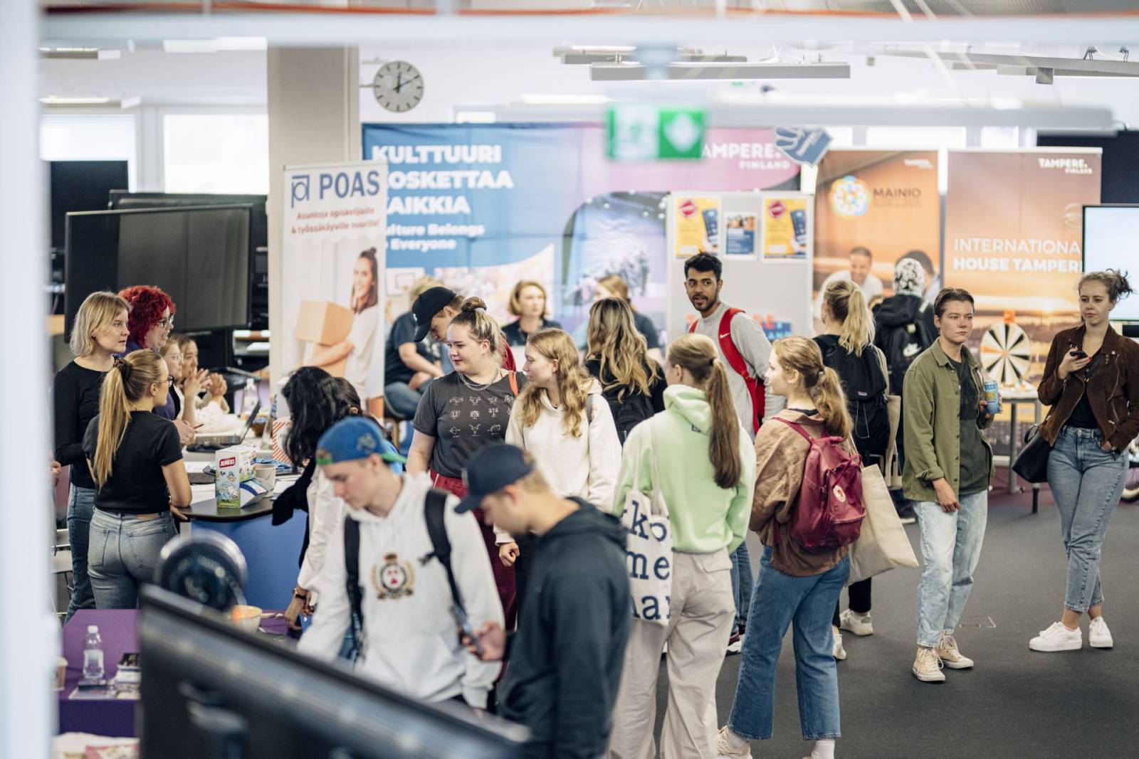 Students gathered around an exhibition table.