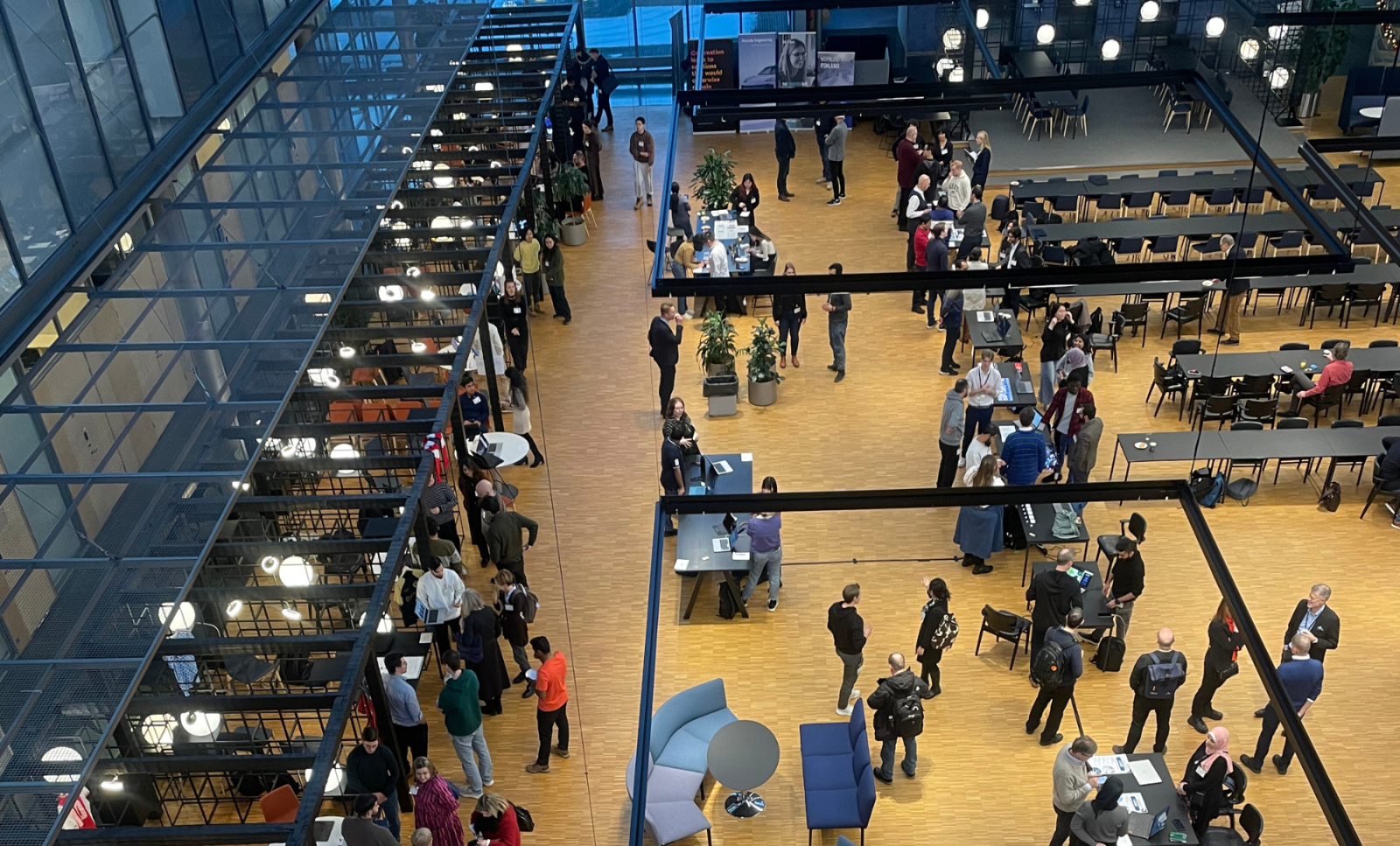 A top view of people milling about at a job fair.