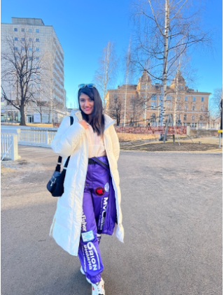 Aisa in her purple student overalls.