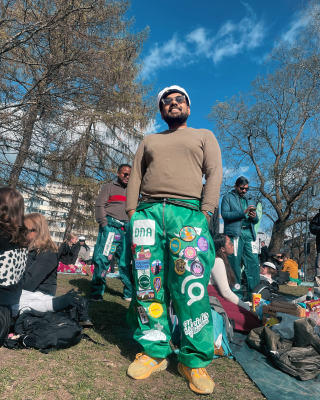 Tanveer in his green student overalls during Wappu 2025.