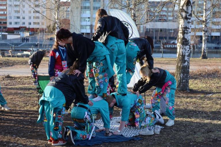 Student building a human pyramid