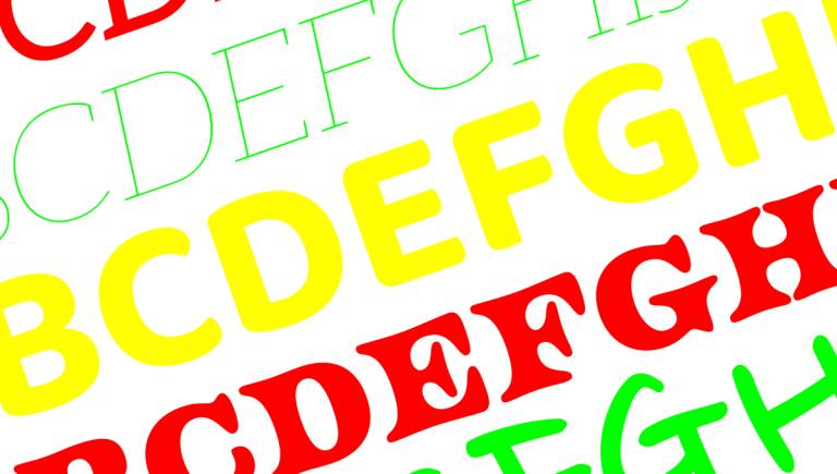 Erivärisiä kirjaimia erilaisilla fonteilla.