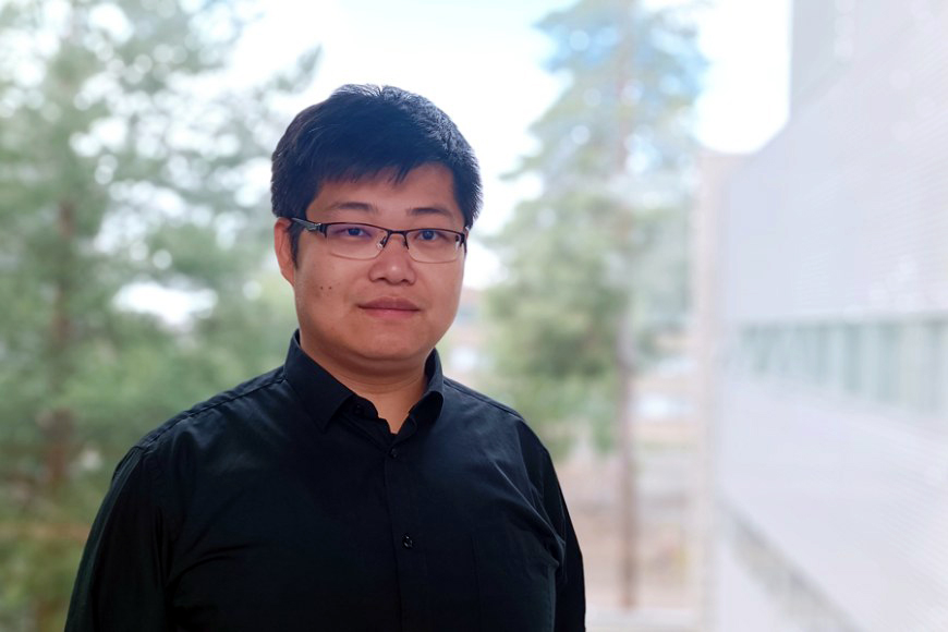 A young man wearing eye glasses.