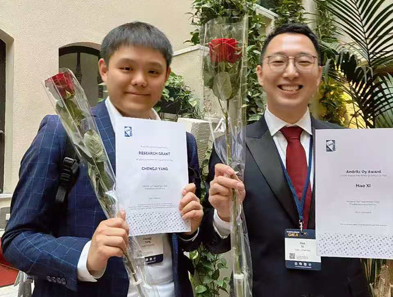 Two young men celebrating graduation.
