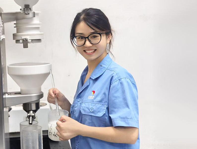A young woman working in a lab.