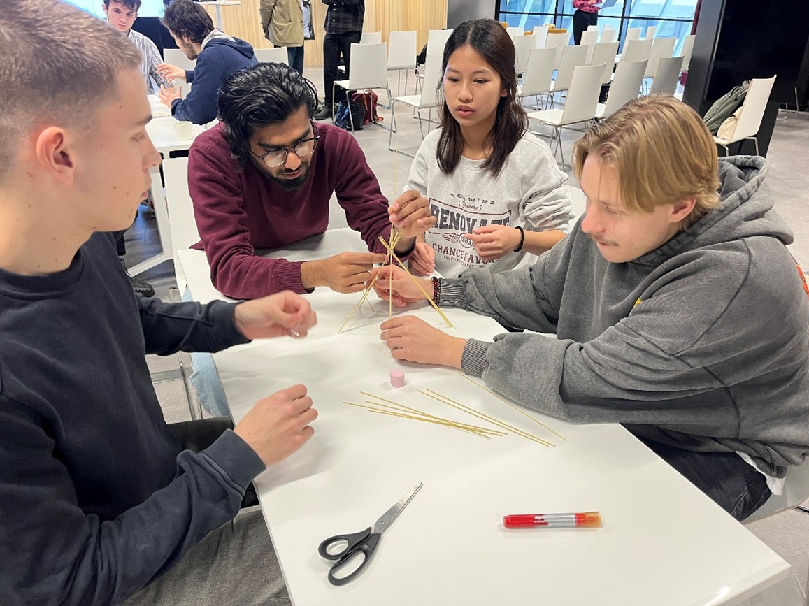 Creativity and cooperation – a group in making a marshmallow tower.