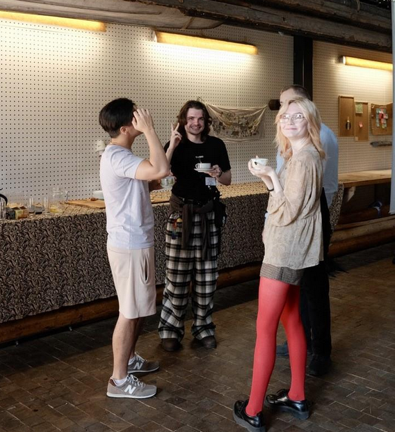 Participants discussing over coffee.