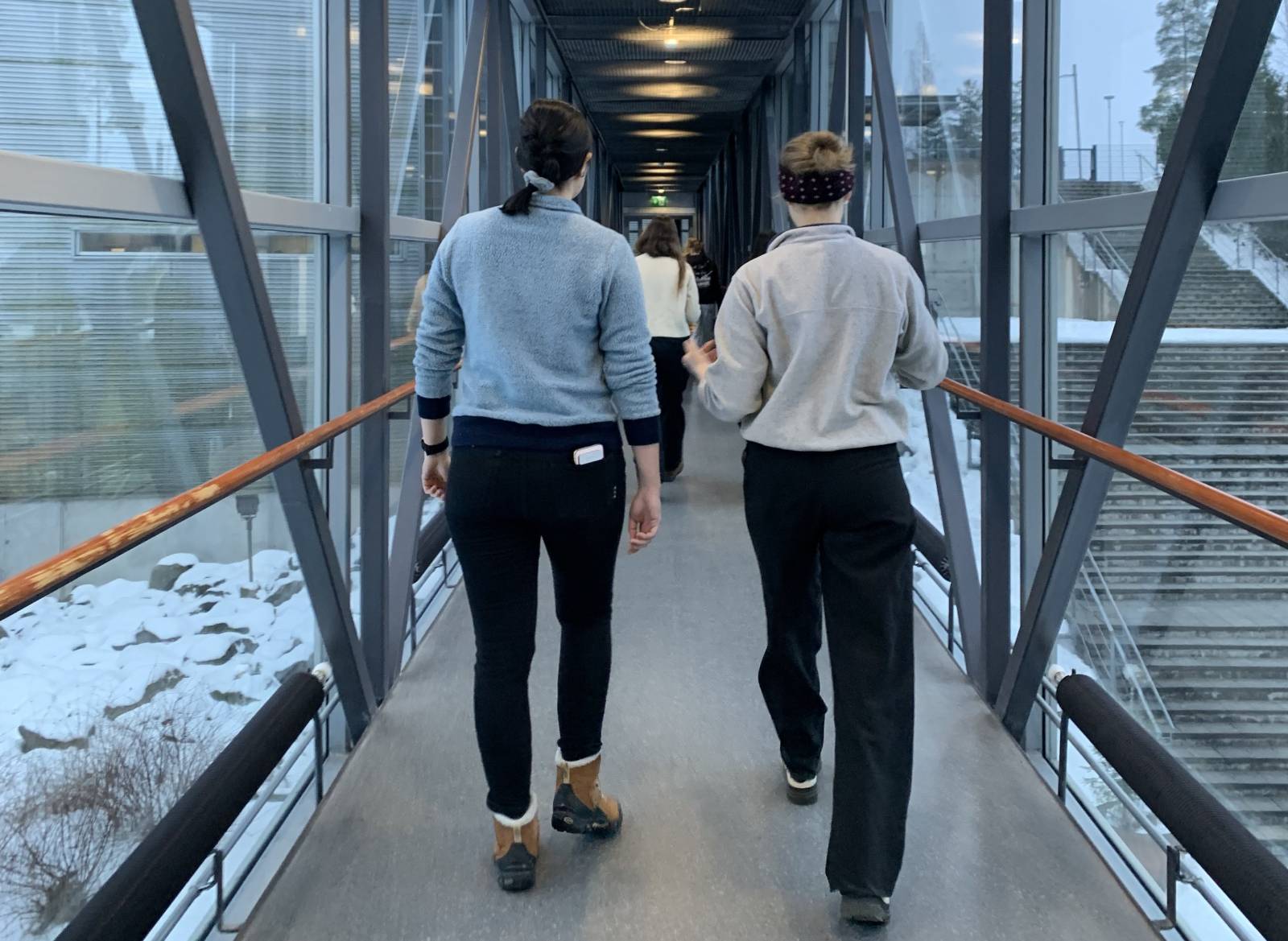 People walking indoors in a walking meeting