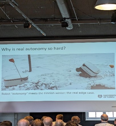 Picture of small delivery robots which have gotten stuck in snow