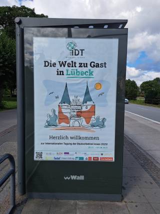 The image shows a street poster