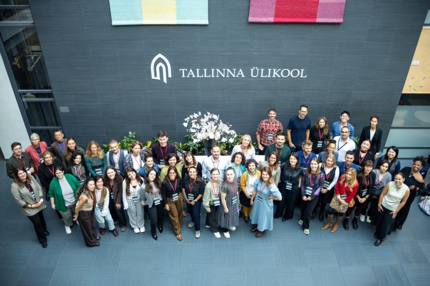 The image a group photo of conference participants