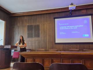 The image shows Prof Dayter presenting her talk