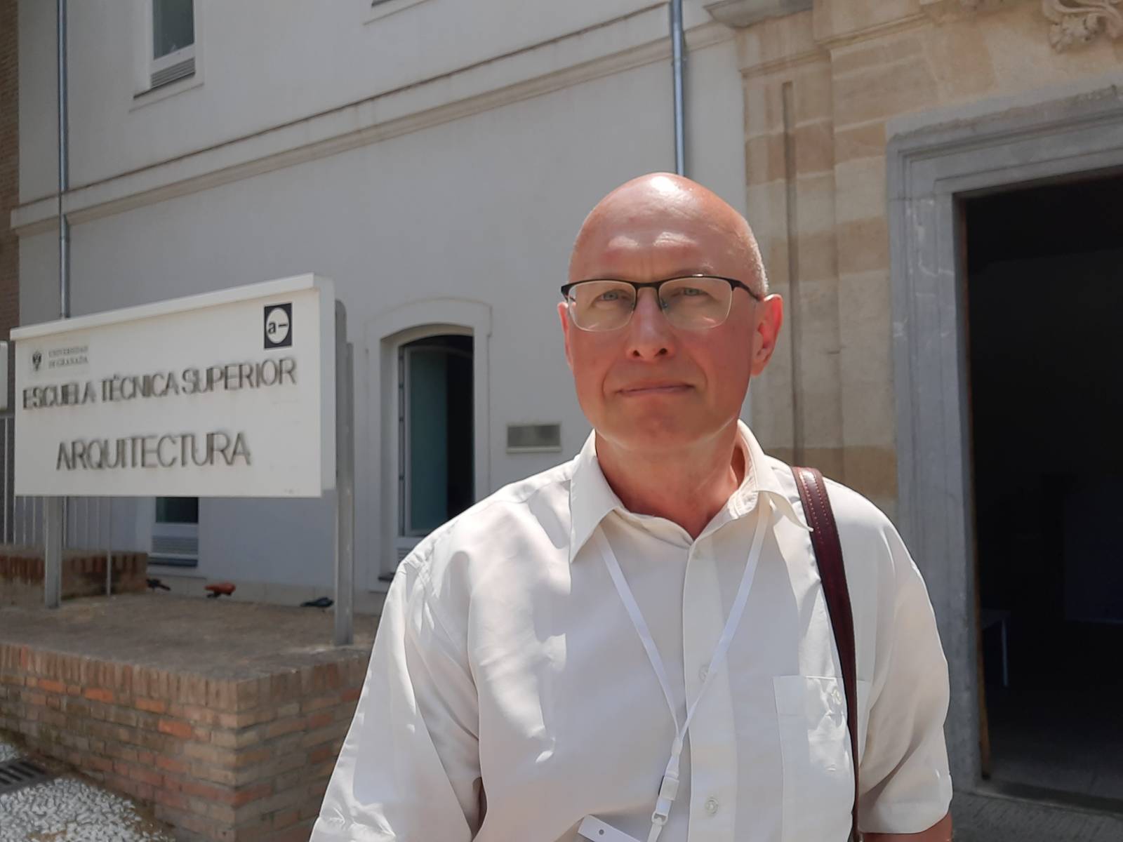 The image shows Prof Mikhailov at the conference site