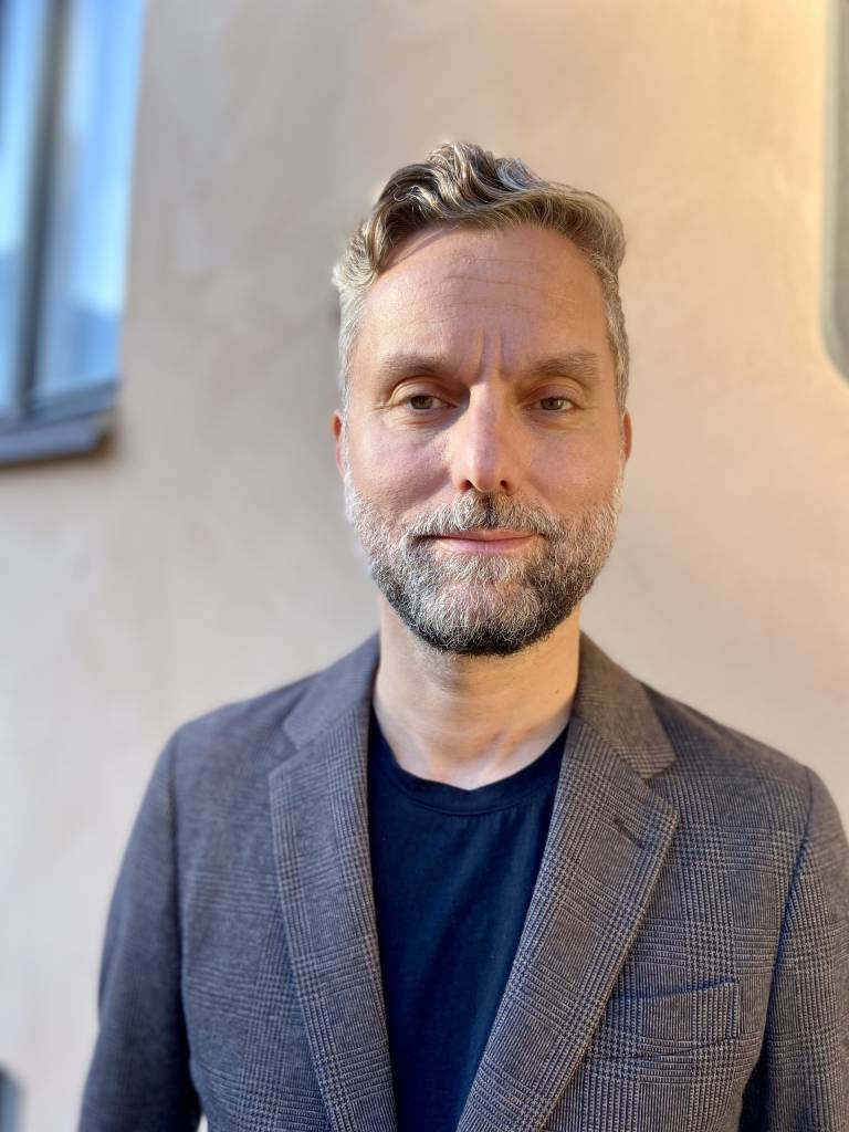 The image is a portrait of Raphael Sannholm