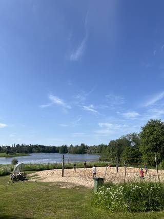 People playing beach volleyball in summer