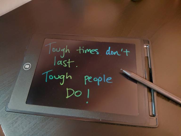 Kirjoituspad, jossa teksti "Though times don't last. Though people do!"