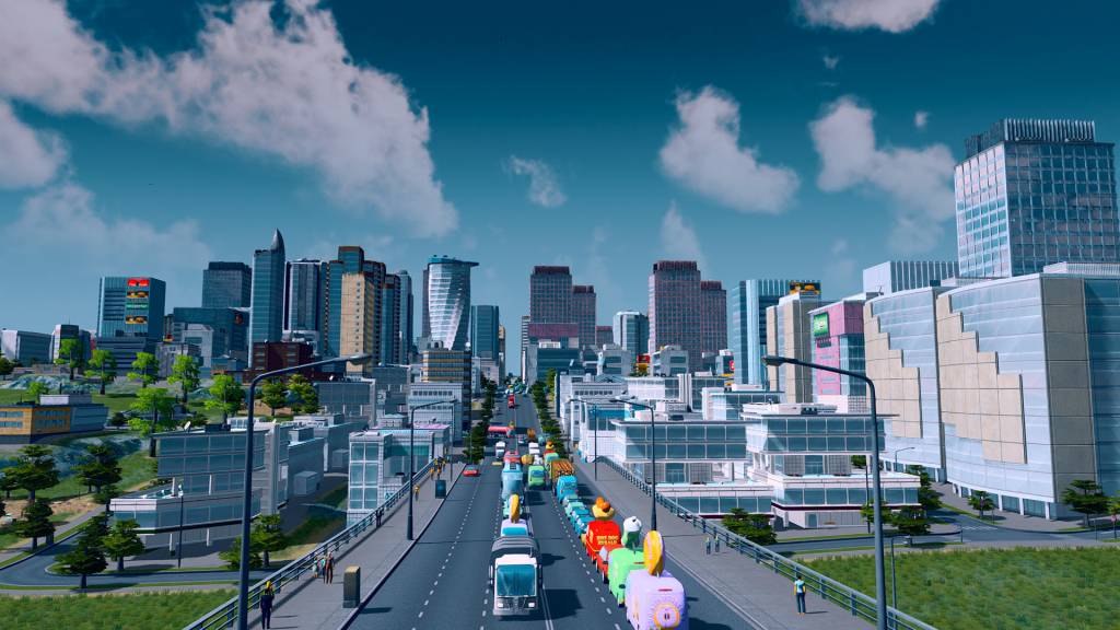 a road towards a skyline of skyscrapers