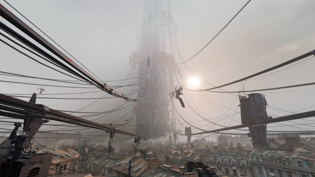 A foggy view of a dirty city on the ground with a giant tower in the middle of it. Tubes, rails and helicopters dominate the airspace.