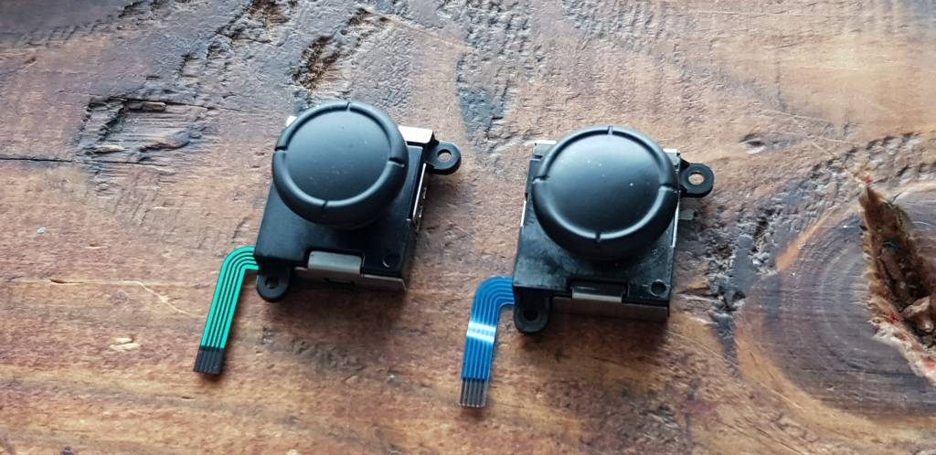 New replacement part next to the old defective one