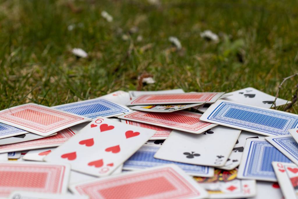 Playing cards on a field