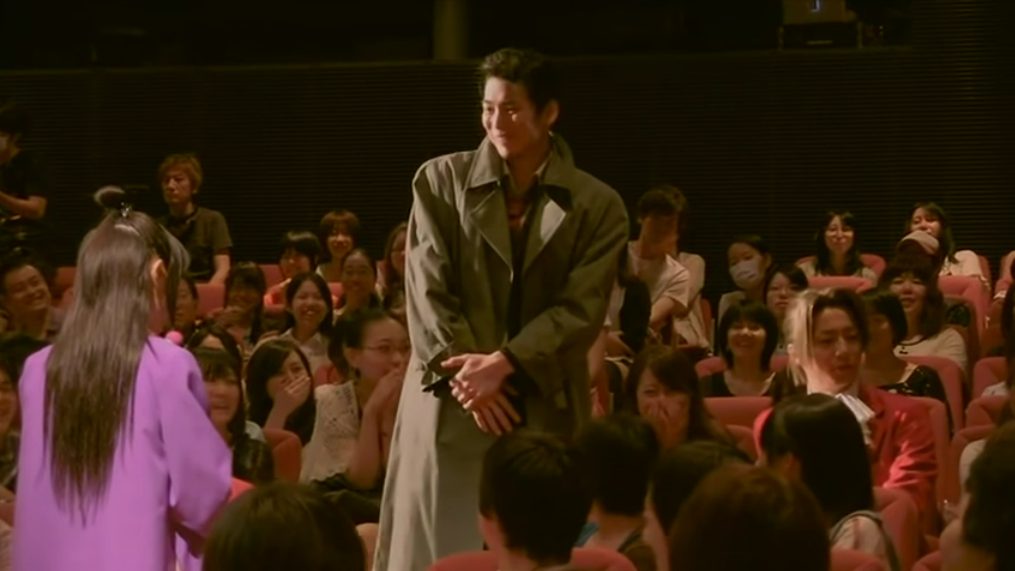 Three characters of the play as part of the actual play audience, while their characters are watching an in-play play