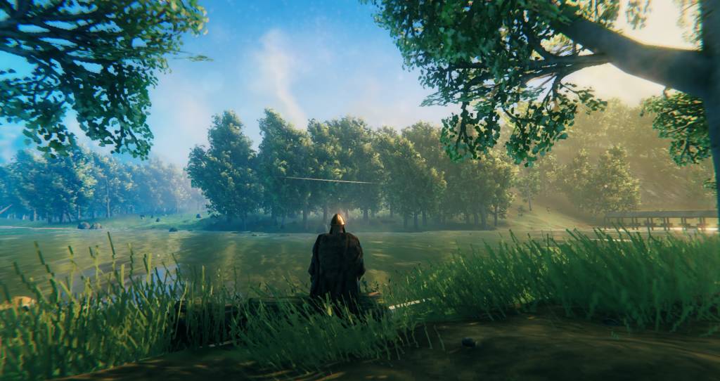 Viking sits looking across a river.