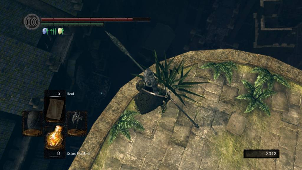 Dark Souls screenshot - the player character looks down from a ledge towards a blue dot in the distance.