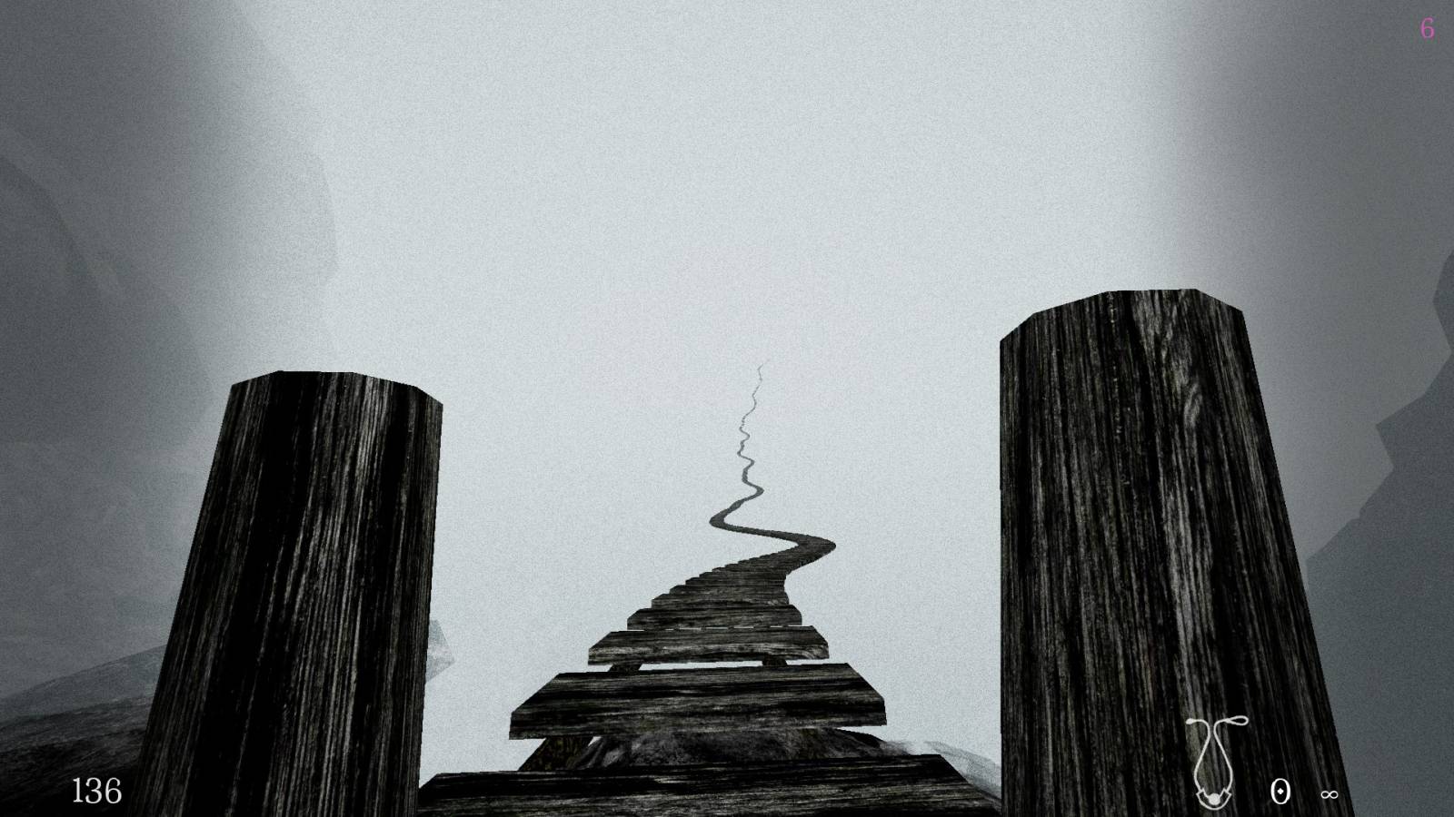 starting from the bottom towards the middle there is a rope bridge extending into the distance