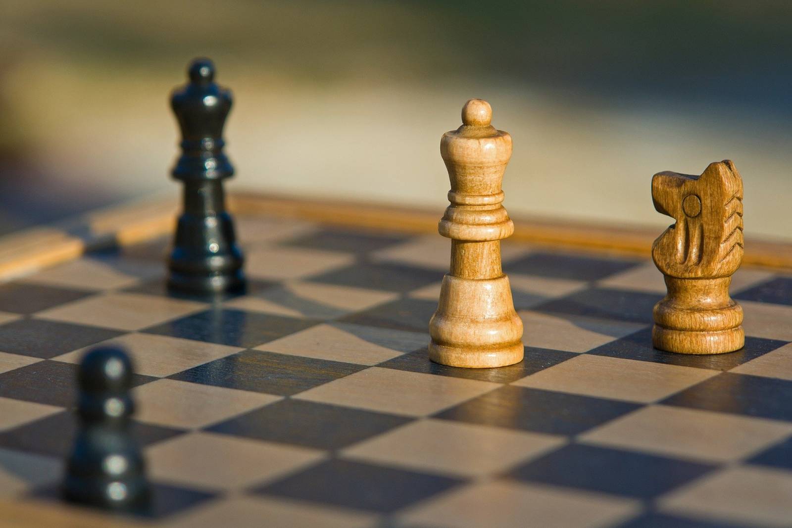 Handful of pieces placed on a chess board