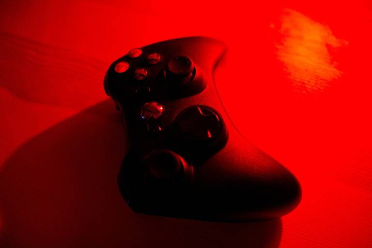 Xbox controller in a blood-red background.