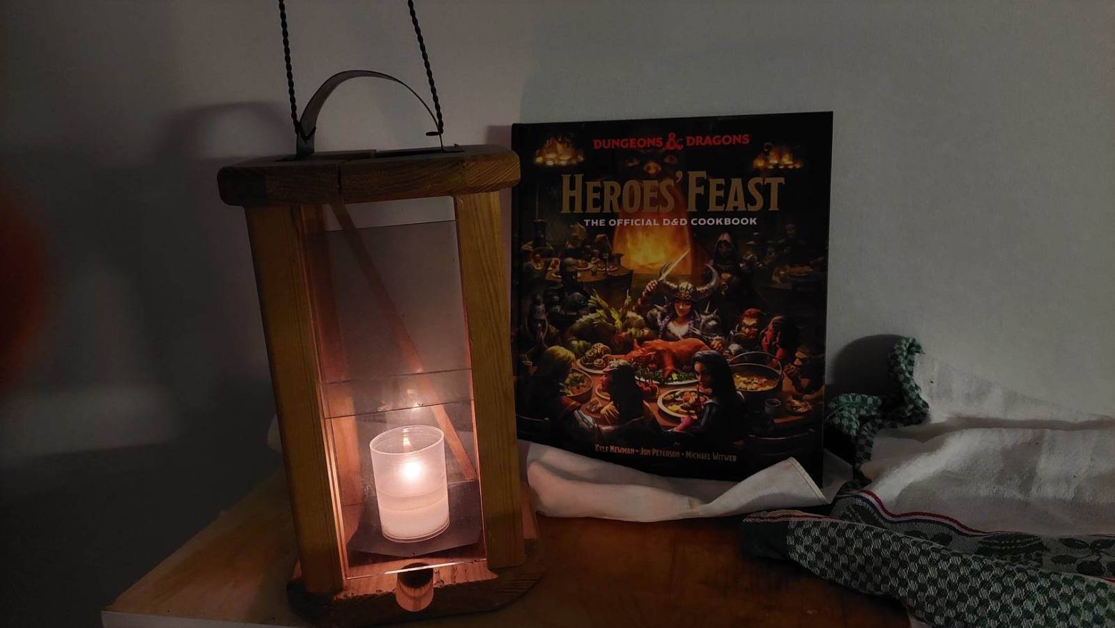 with candle burning inside it. Behind it