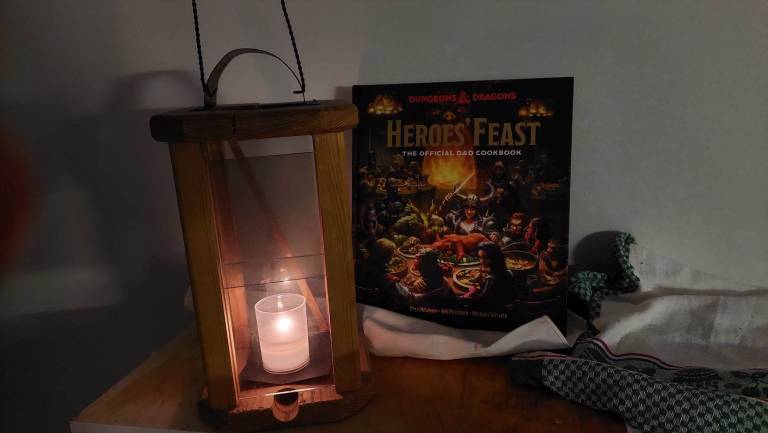 with candle burning inside it. Behind it