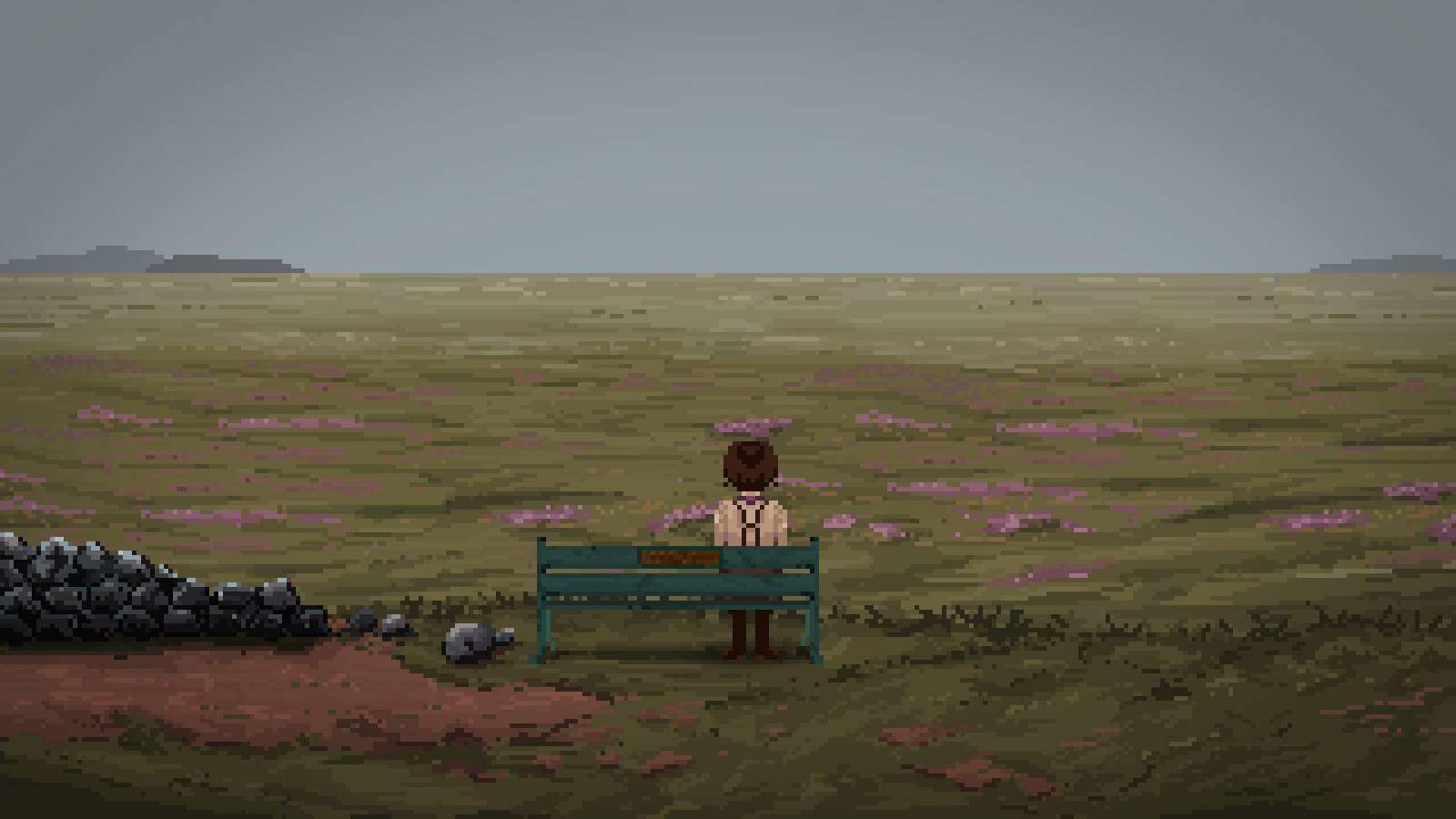 overlooking the moors. Sky is grey. Left from the bench there are ruins of an old stone fence.