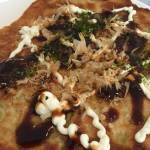 Okonomiyaki topped with mayo, okonomiyaki sauce, bonito flakes and seaweed flakes :)