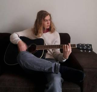 Erkki playing guitar