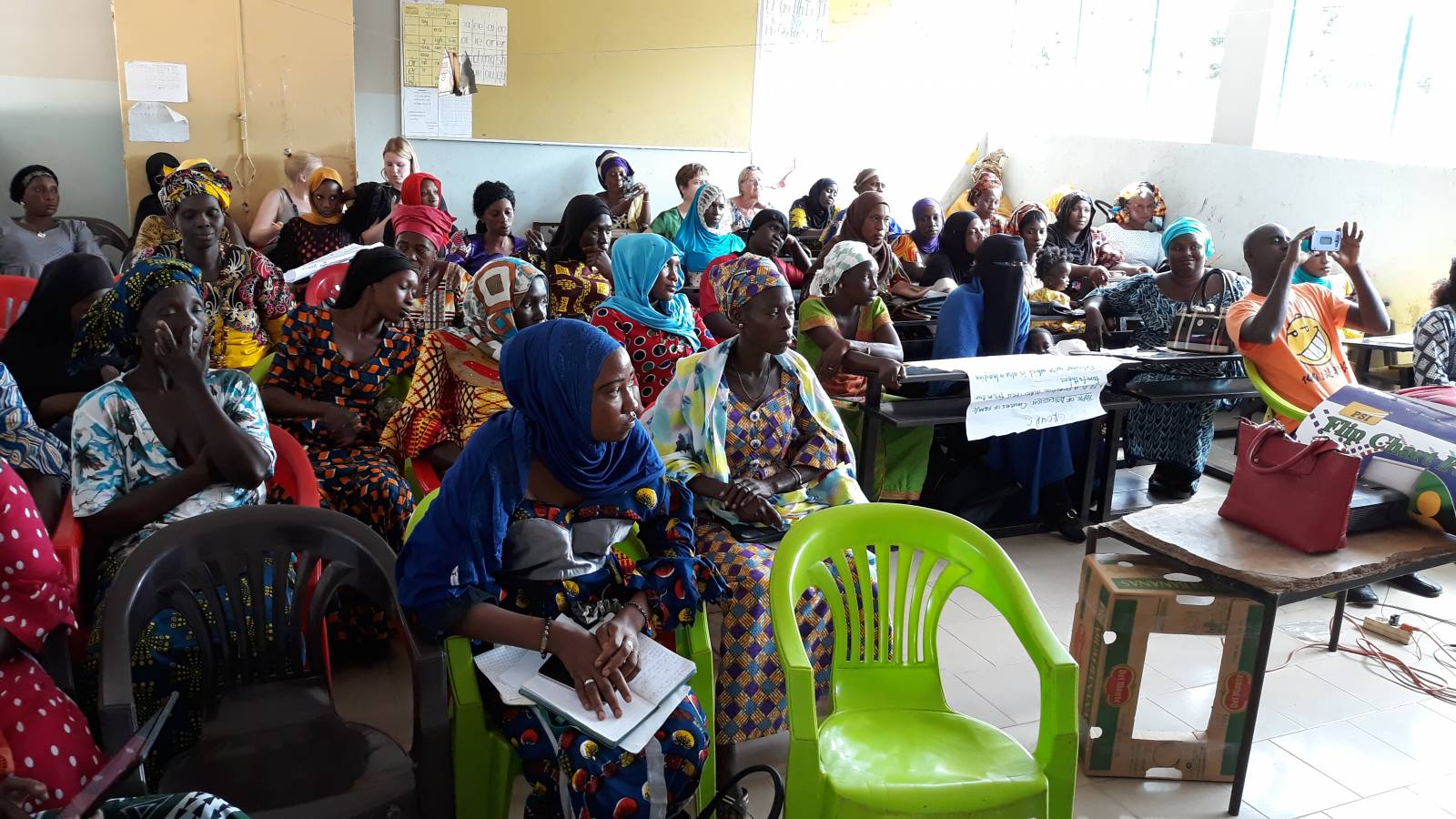 A group of local women listening a lecture of female genital mutilation.
