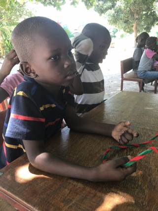 A boy making a headband.