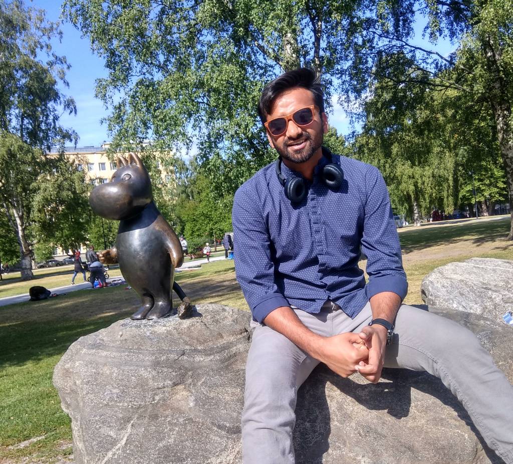 Satyam sitting on a rock