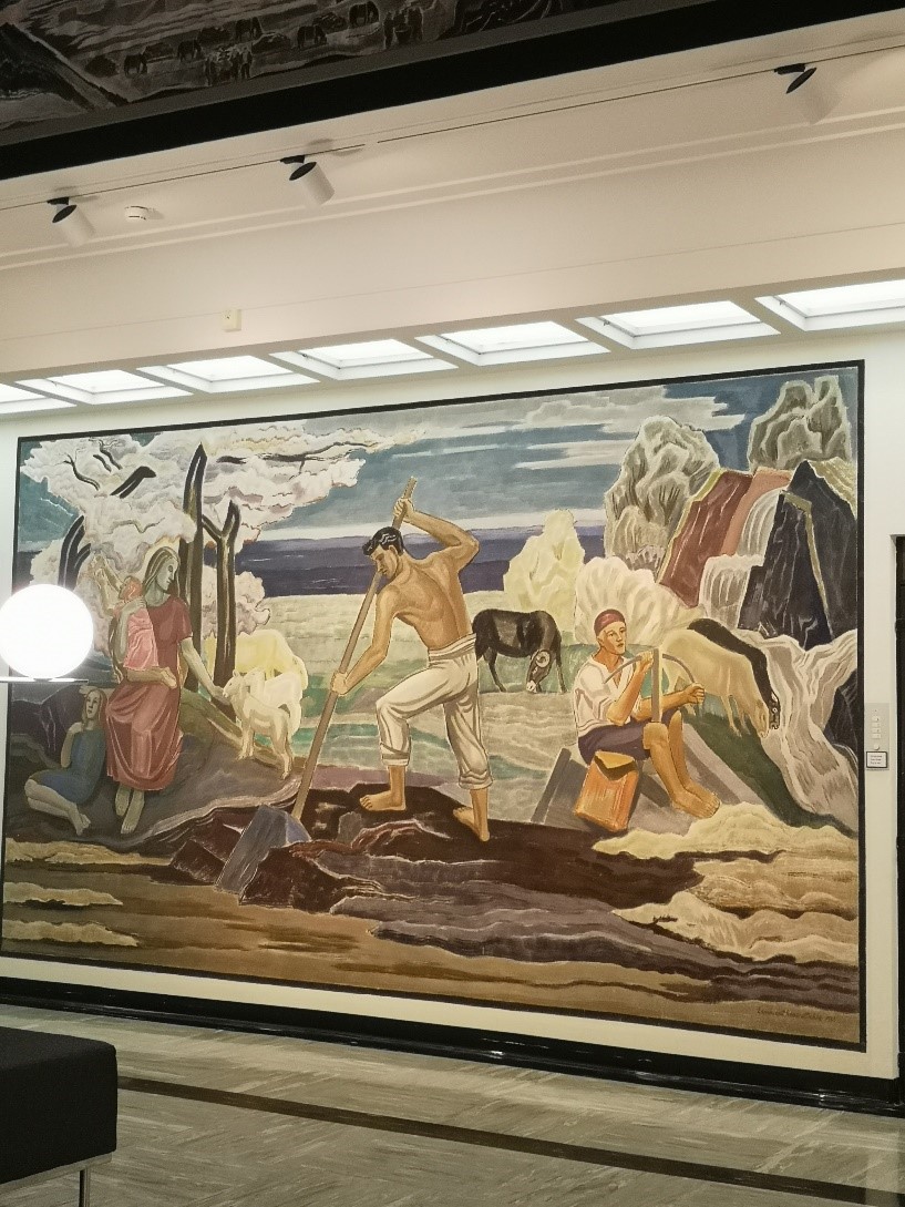 a mural picturing people on the seaside, working and taking care of children and animals